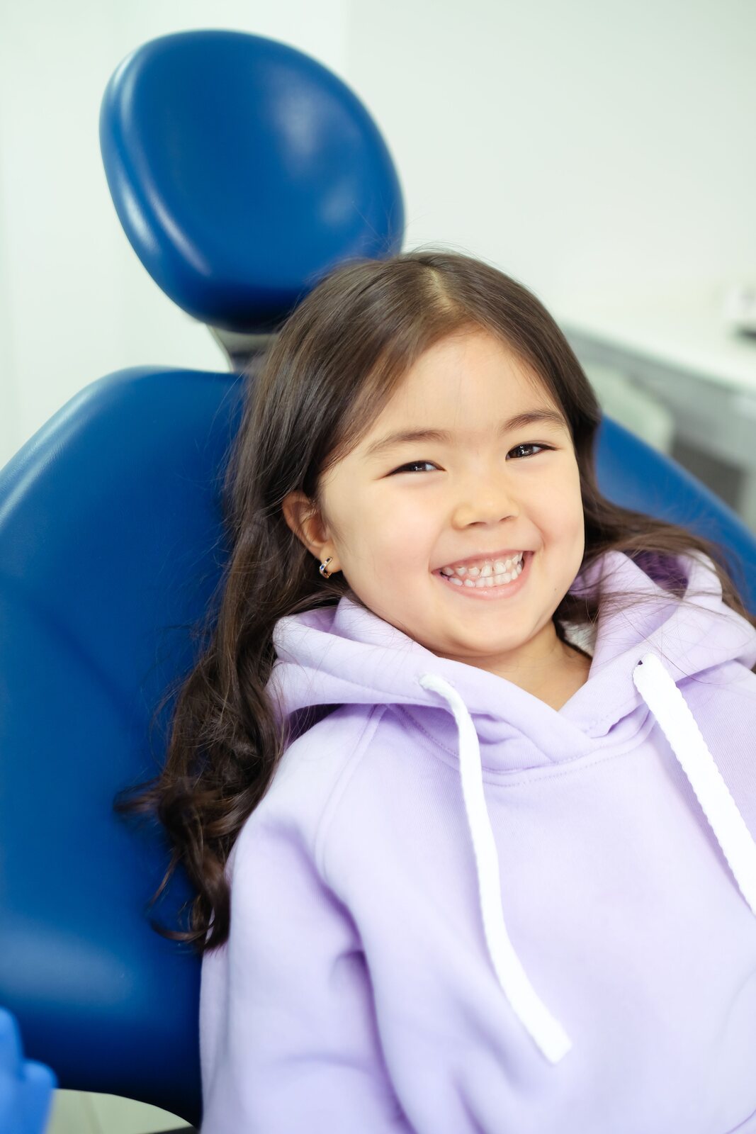 Child smiling during a dental visit
